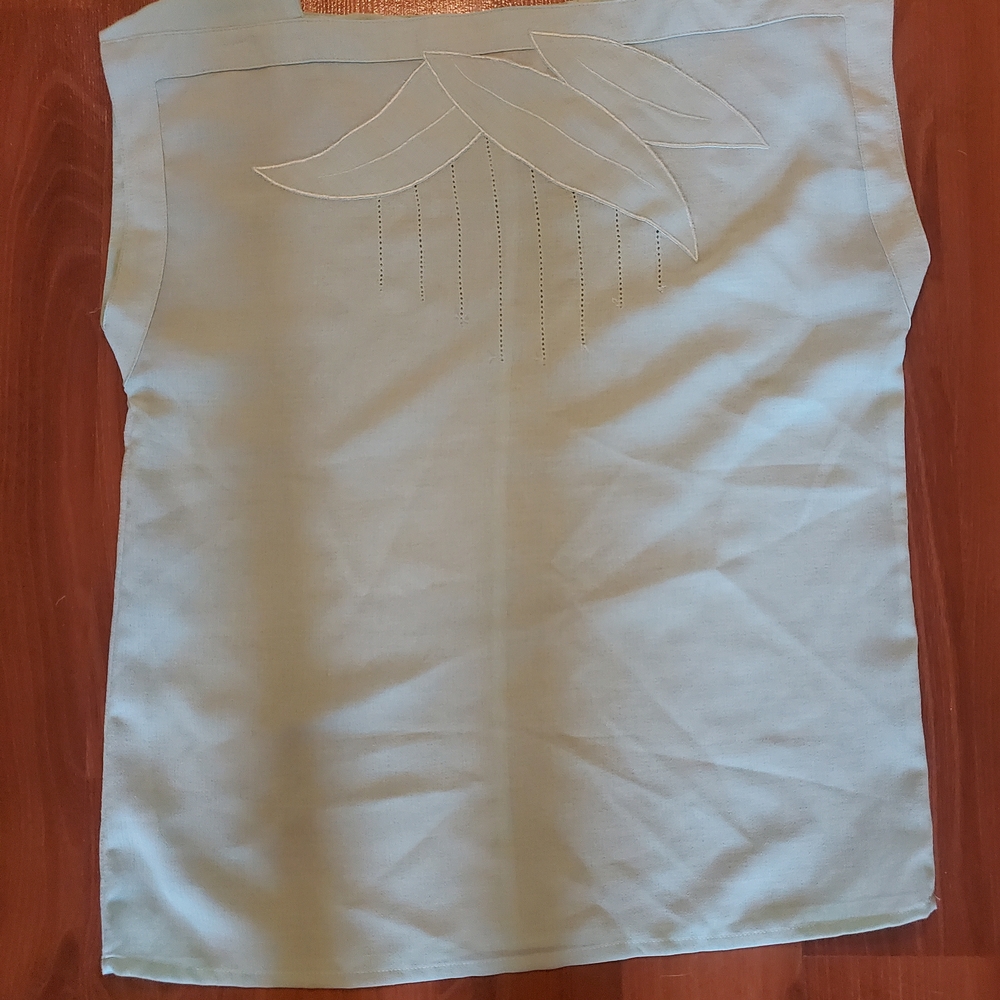 Elegant Sleeveless Top with Embroidered Design